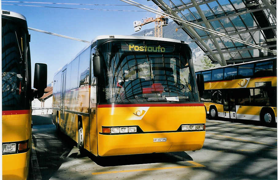 (062'236) - PostAuto Graubnden - GR 102'394 - Neoplan (ex P 25'861) am 30. Juli 2003 in Chur, Postautostation
