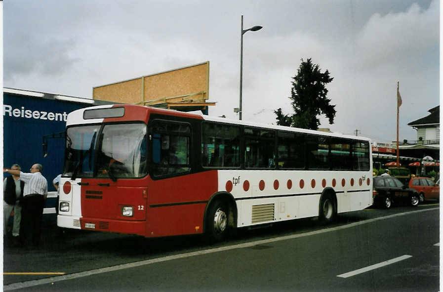 (087'105) - TPF Fribourg - Nr. 12/FR 300'309 - Volvo/Lauber (ex GFM Fribourg Nr. 12) am 28. Juni 2006 beim Bahnhof Thun