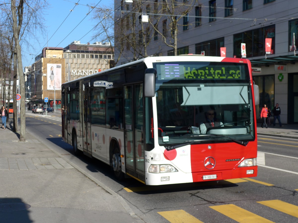 (149'277) - TPF Fribourg - Nr. 382/FR 300'383 - Mercedes am 9. Mrz 2014 beim Bahnhof Fribourg