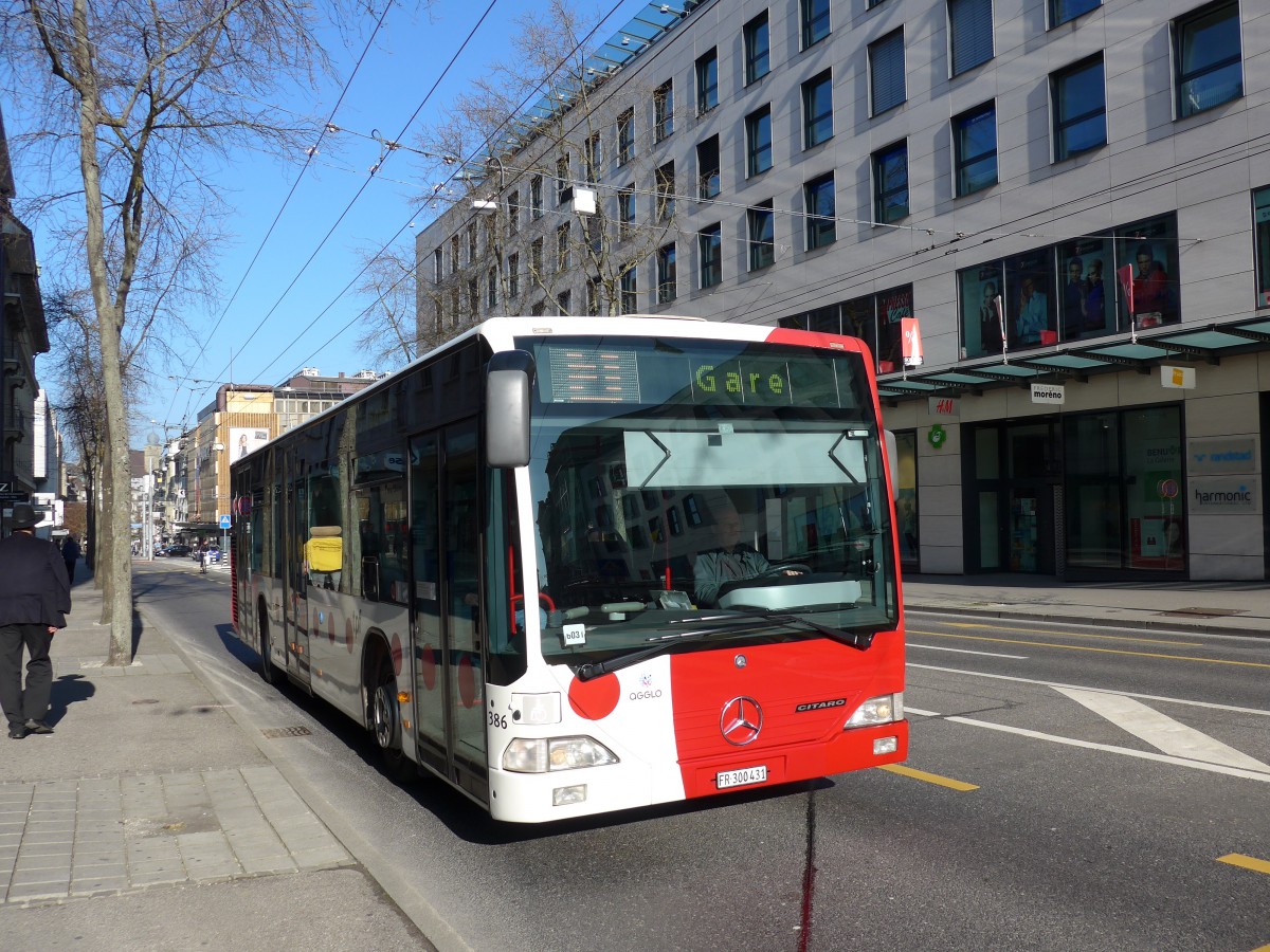 (149'286) - TPF Fribourg - Nr. 386/FR 300'431 - Mercedes am 9. Mrz 2014 beim Bahnhof Fribourg