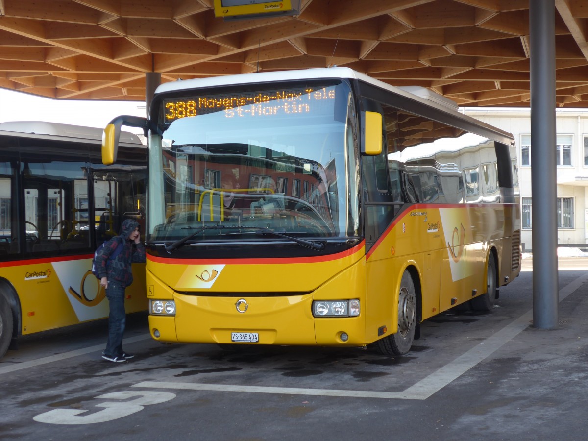 (158'050) - PostAuto Wallis - Nr. 23/VS 365'404 - Irisbus am 1. Januar 2015 beim Bahnhof Sion
