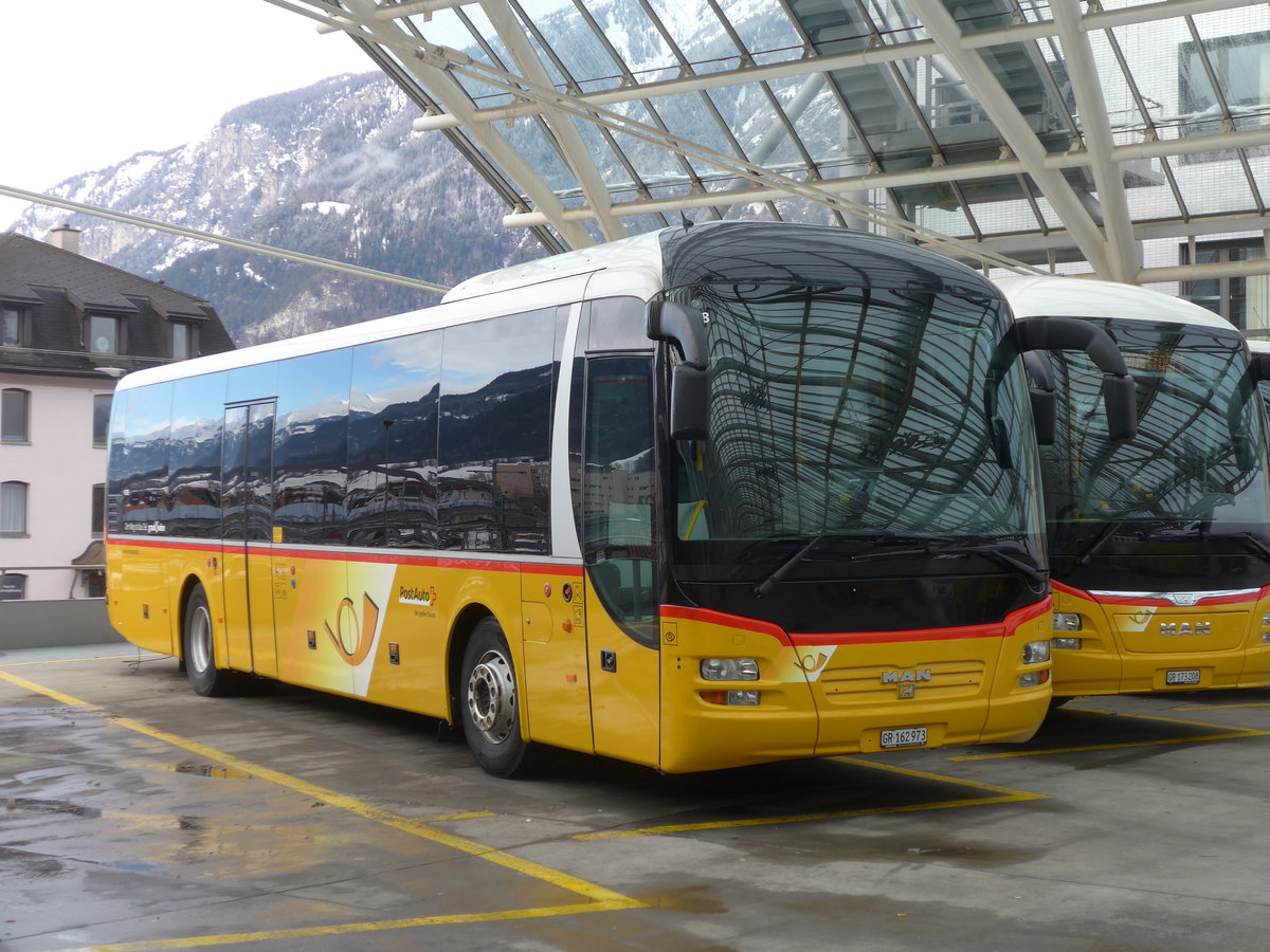(187'545) - PostAuto Graubnden - GR 162'973 - MAN am 1. Januar 2018 in Chur, Postautostation