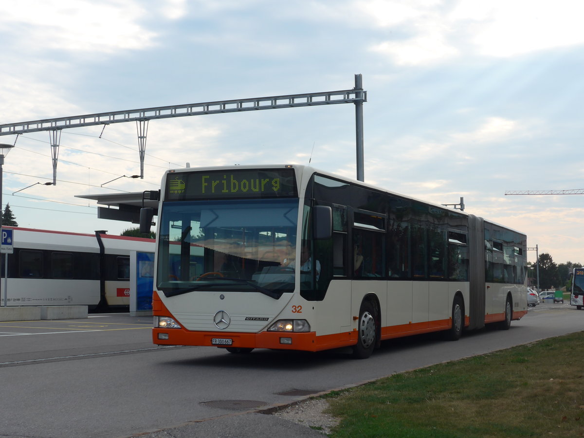 (195'338) - BSU Solothurn - Nr. 32/FR 300'667 - Mercedes (ex RBS Worblaufen Nr. 77) am 31. Juli 2018 beim Bahnhof Grolley