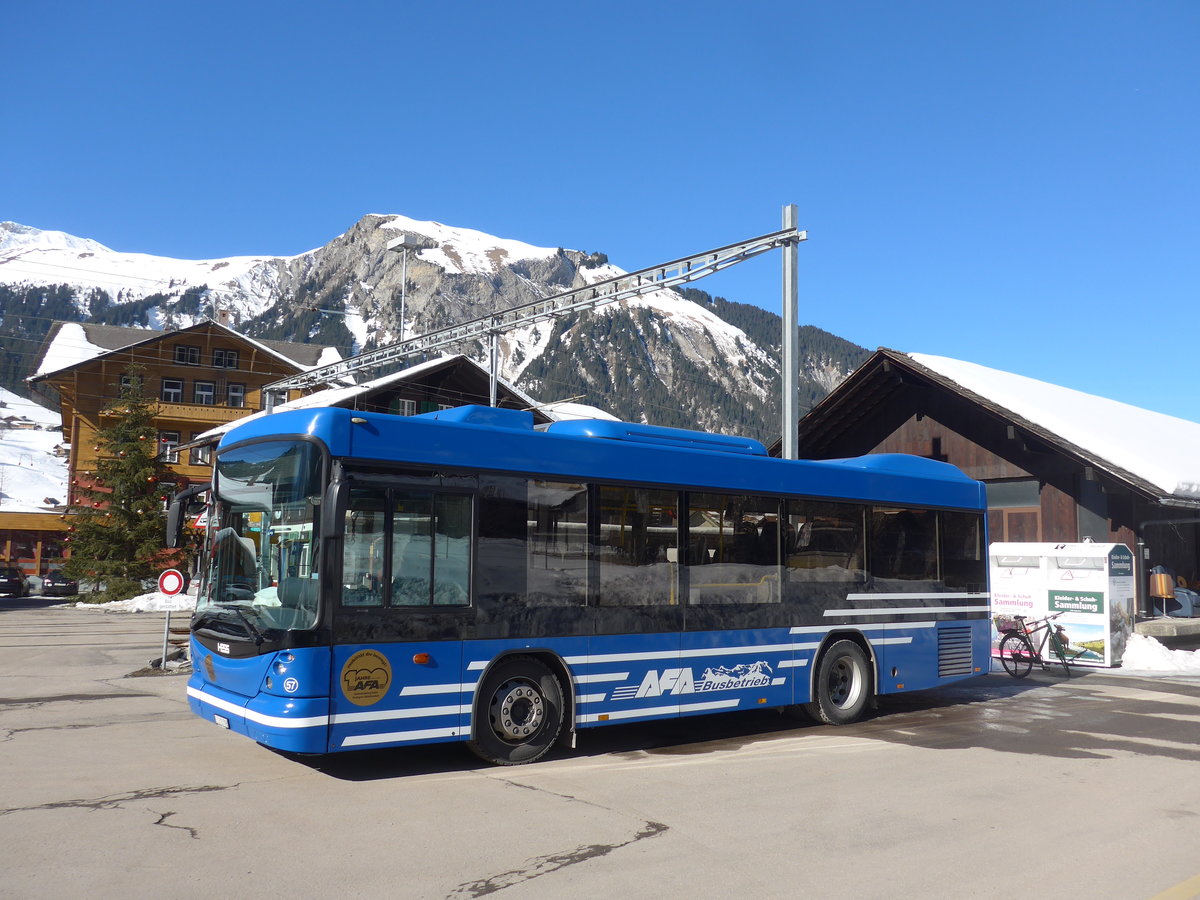 (201'672) - AFA Adelboden - Nr. 57/BE 272'798 - Scania/Hess am 17. Februar 2019 beim Bahnhof Lenk