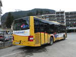 (246'218) - Grindelwaldbus, Grindelwald - Nr. 18/BE 382'871 - MAN/Gppel am 17. Februar 2023 beim Bahnhof Grindelwald