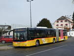 MAN/763014/231248---carpostal-ouest---ju (231'248) - CarPostal Ouest - JU 52'076 - MAN (ex Nr. 38) am 14. Dezember 2021 beim Bahnhof Moudon