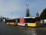 MAN/763017/231251---carpostal-ouest---ju (231'251) - CarPostal Ouest - JU 52'076 - MAN (ex Nr. 38) am 14. Dezember 2021 beim Bahnhof Moudon