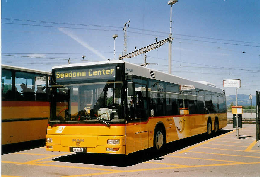 (061'030) - Schuler, Feusisberg - SZ 45'324 - MAN am 21. Juni 2003 beim Bahnhof Pfffikon