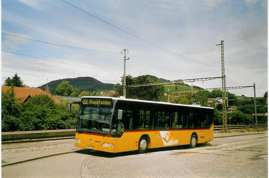 (069'306) - PostAuto Nordwestschweiz - BL 167'326 - Mercedes (ex P 25'222) am 10. Juli 2004 beim Bahnhof Gelterkinden