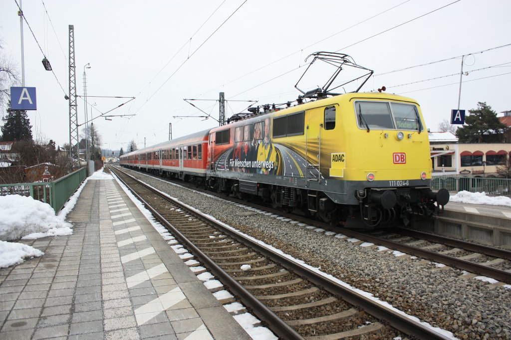 111 024-6 die  ADAC -Lok auf dem Weg nach M�nchen. Aufgenommen am 18. Februar 2013 in Prien am Chiemsee.