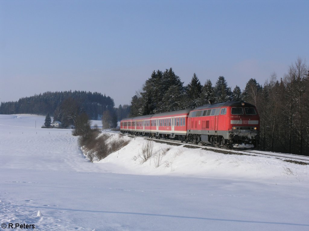218 458-8 zieht bei K�sers den RE32715 nach Obersdorf. 15.02.10