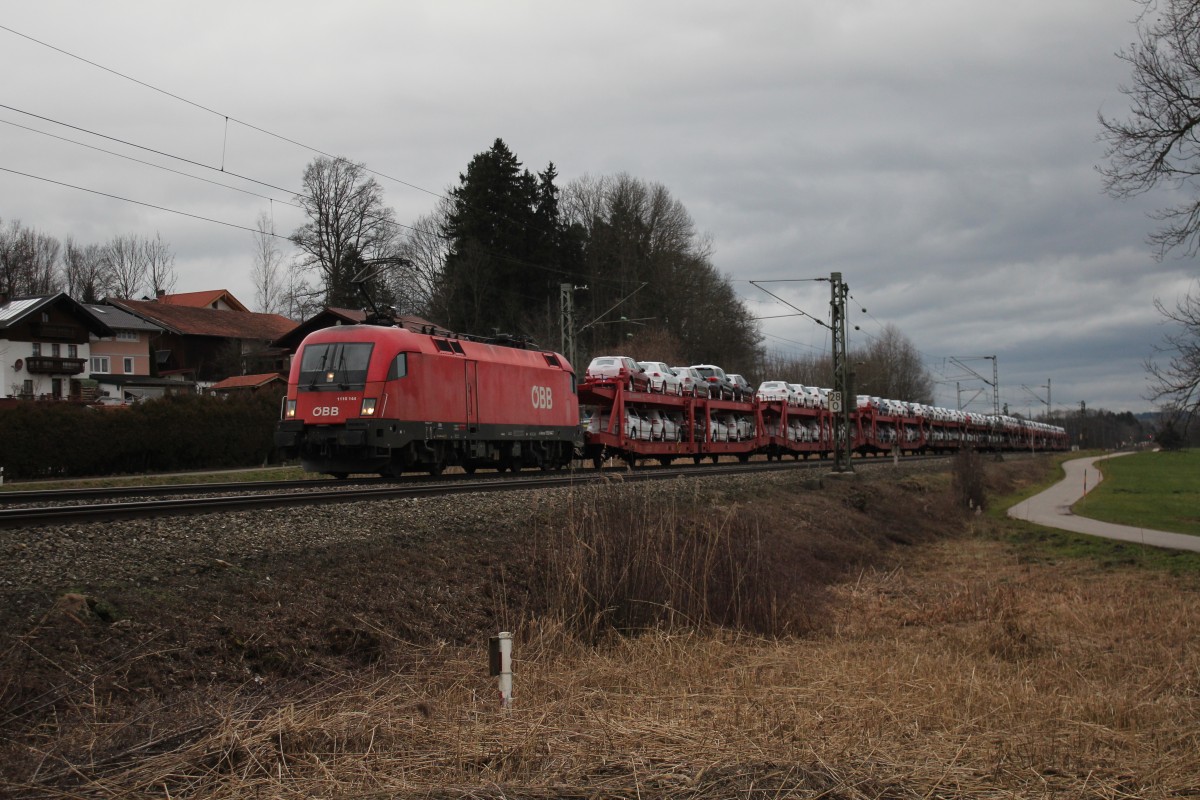 1116 144-5 mit einem Autozug aus Mnchen kommend am 14. Januar 2015 bei Weisham.