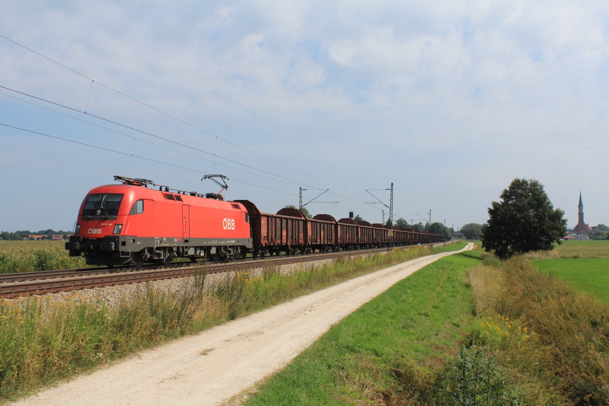 1116 188-4 mit einem Ganzzug offener Gterwagen am 24. August 2013 bei bersee am Chiemsee.