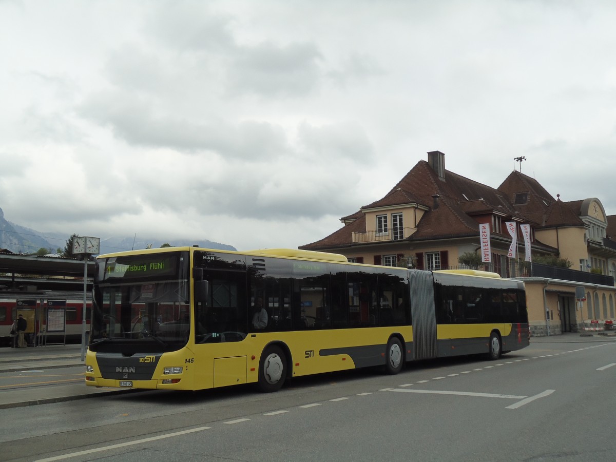 (144'523) - STI Thun - Nr. 145/BE 801'145 - MAN am 25. Mai 2013 beim Bahnhof Spiez