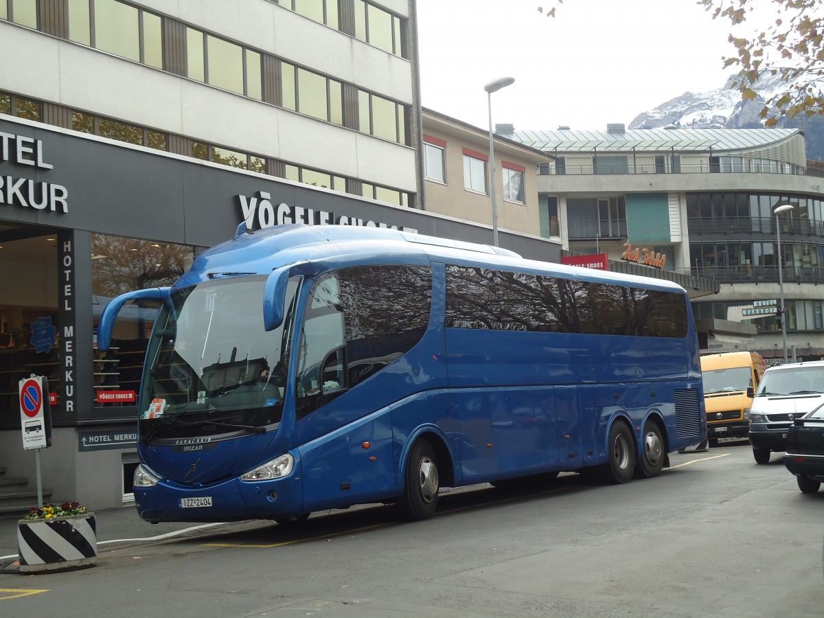 (147'582) - Aus Griechenland: Saracakis - IZZ-2404 - Volvo/Irizar am 4. November 2013 beim Bahnhof Interlaken West
