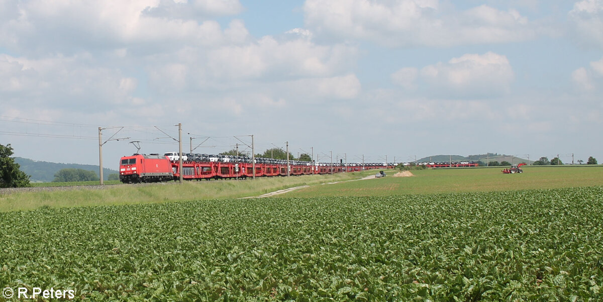 185 316-7 zieht bei Uffenheim ein Autotransportzug in Richtung Norden. 04.06.24
