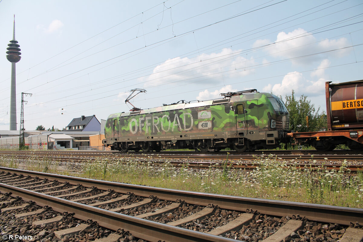 193 234  Grüner Offroad  zieht mit einem KLV Zug durch Nürnberg Hohe Marter. 24.07.24