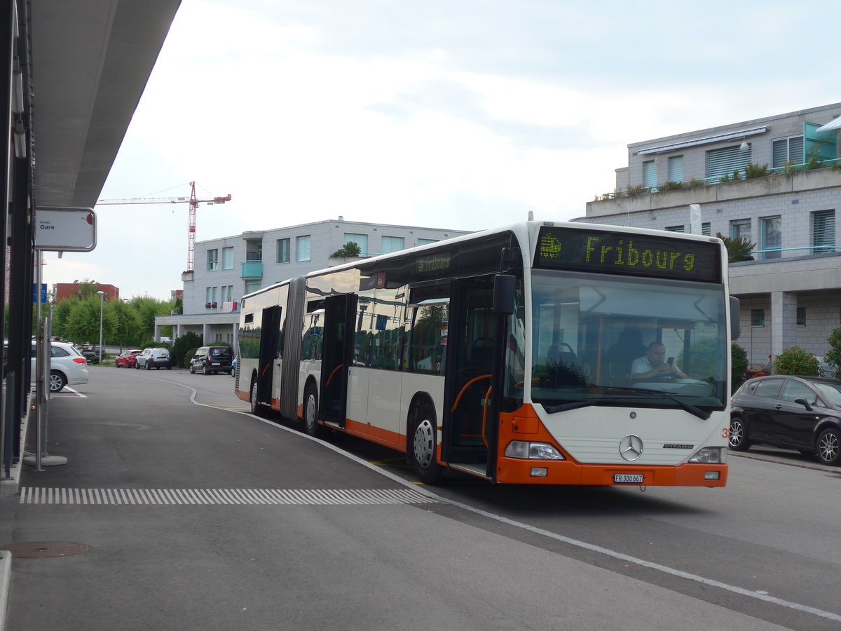 (195'335) - BSU Solothurn - Nr. 32/FR 300'667 - Mercedes (ex RBS Worblaufen Nr. 77) am 31. Juli 2018 beim Bahnhof Grolley (Einsatz Intertours)