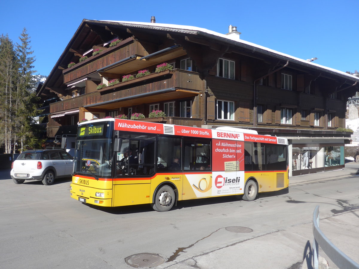 (201'692) - PostAuto Bern - BE 614'040 - MAN/Gppel (ex AVG Meiringen Nr. 72) am 17. Februar 2019 beim Bahnhof Gstaad