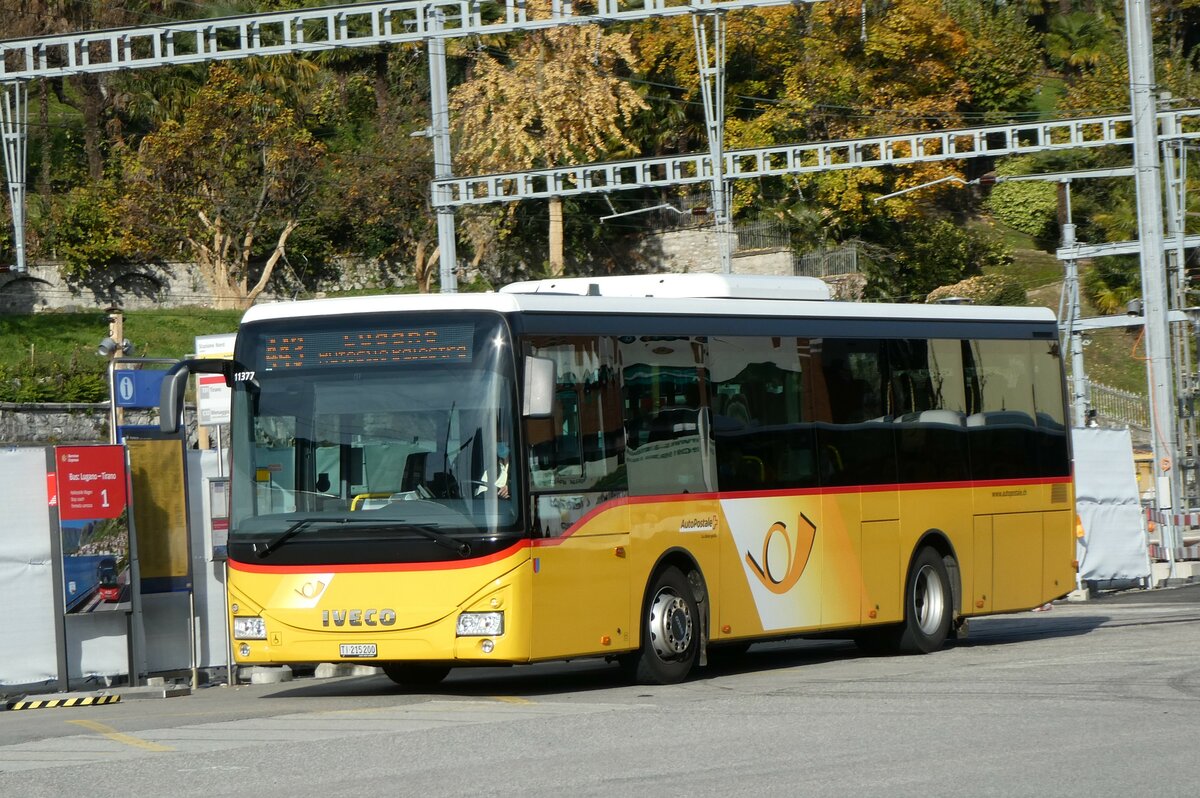 (230'312) - AutoPostale Ticin - TI 215'200 - Iveco (ex Vorfhrfahrzeug) am 10. November 2021 beim Bahnhof Lugano