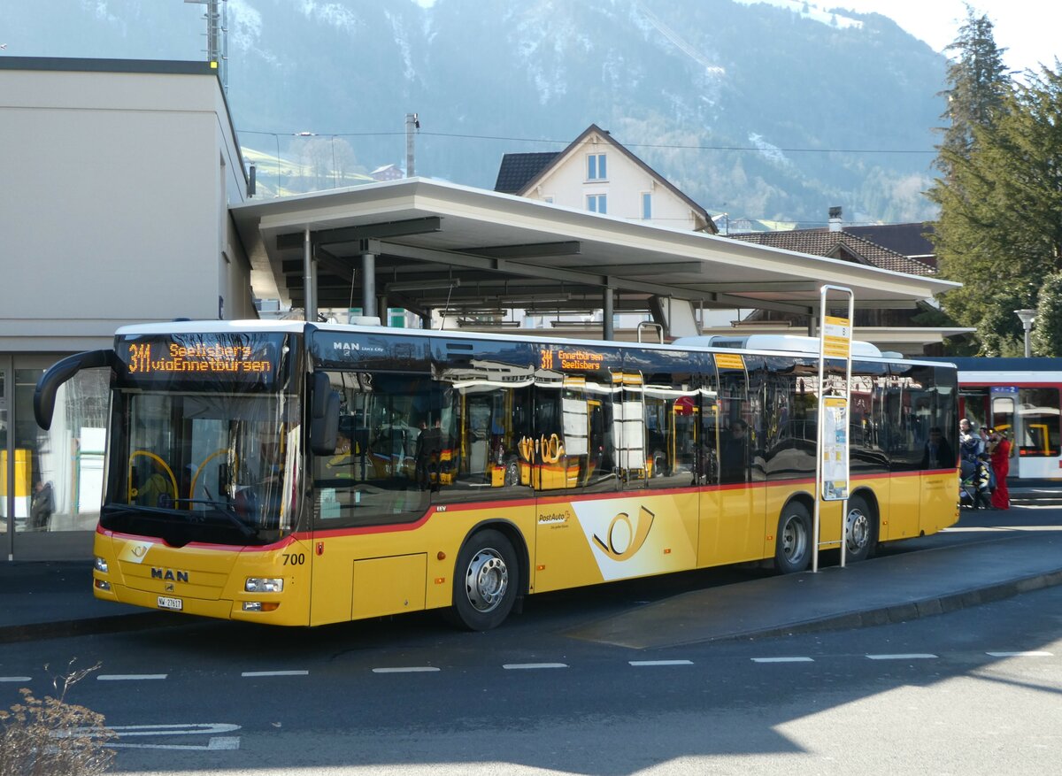 (246'166) - PostAuto Zentralschweiz - Nr. 700/NW 27'617/PID 5569 - MAN (ex Niederer, Filzbach Nr. 12; ex PostAuto Ostschweiz) am 16. Februar 2023 beim Bahnhof Stans