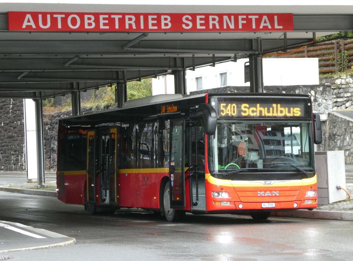 (256'605) - AS Engi - Nr. 2/GL 7702 - MAN (ex Gessert, D-Finsterbergen; ex Herrmann, D-Schnau vor dem Walde) am 31. Oktober 2023 beim Bahnhof Schwanden