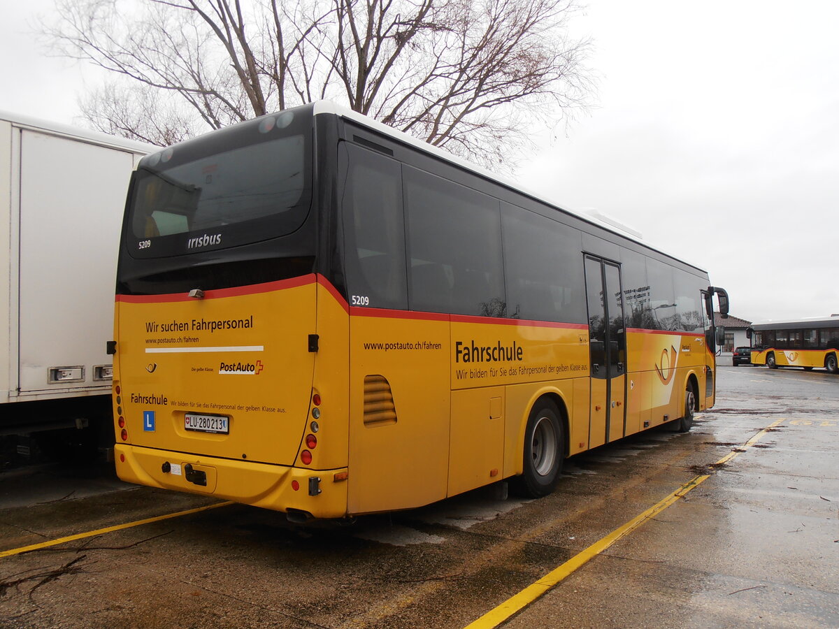 (257'765) - PostAuto Zentralschweiz - LU 280'213/PID 5209 - Irisbus (ex PostAuto Ostschweiz) am 21. Dezember 2023 in Yverdon, Garage