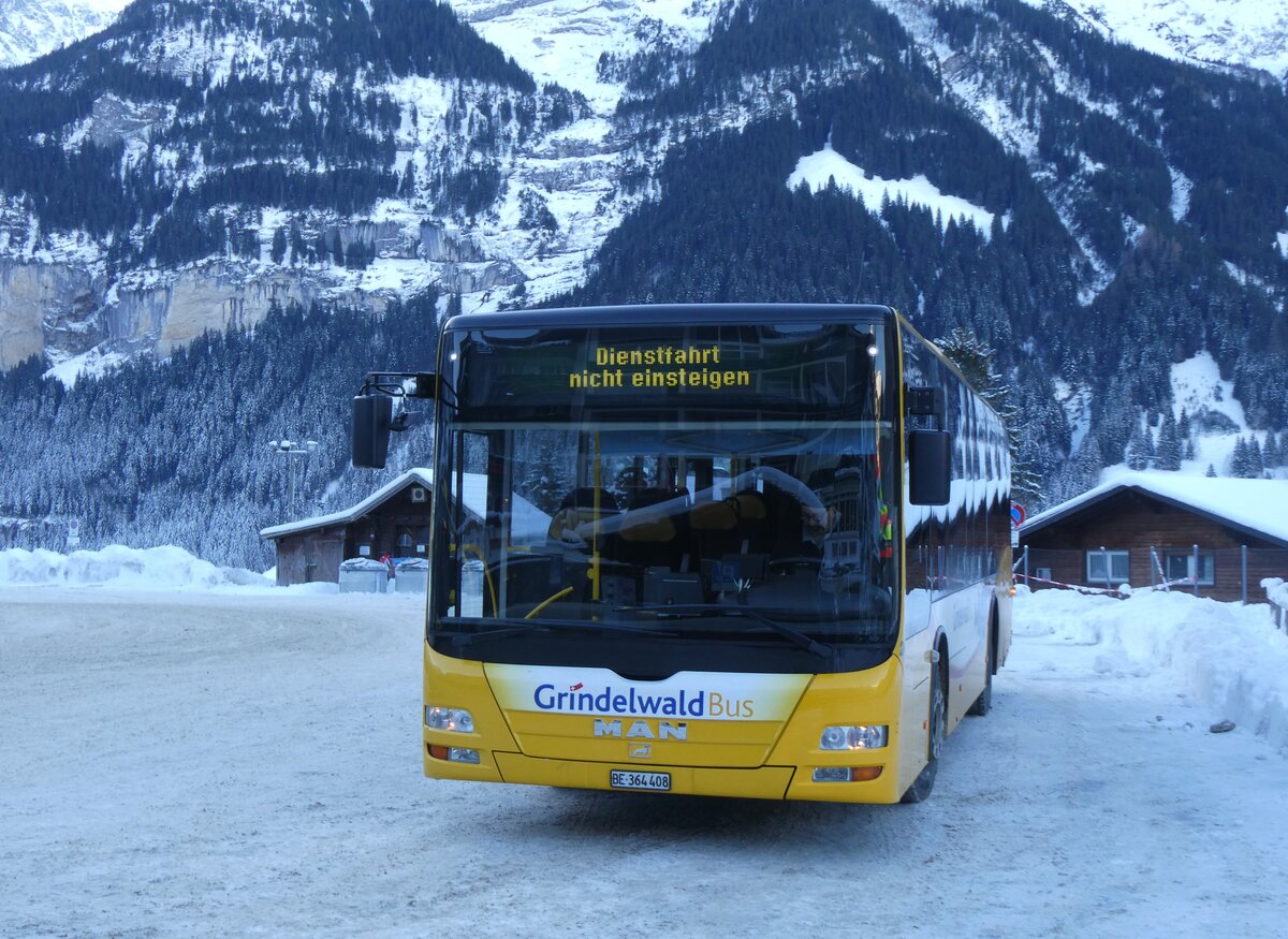 (270'335) - GrindelwaldBus, Grindelwald - Nr. 24/BE 364'408 - MAN/Gppel am 29. Dezember 2024 beim Bahnhof Grindelwald