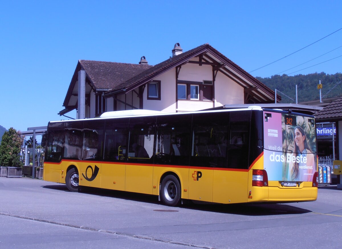 (289'978) - PostAuto Zentralschweiz - OW 26'301/PID 12'338 - MAN (ex Nr. 530; ex Dr. Richard, A-Wien Nr. 1418) am 28. Juli 2026 beim Bahnhof Alpnach-Dorf