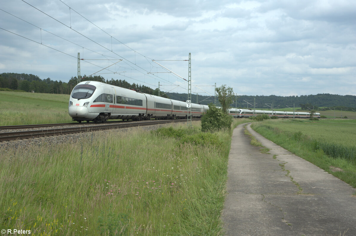 411 074  Hansestadt Warburg  + 411 009 als ICE 92 Wien - Hamburg bei Oberdachstetten. 08.06.24