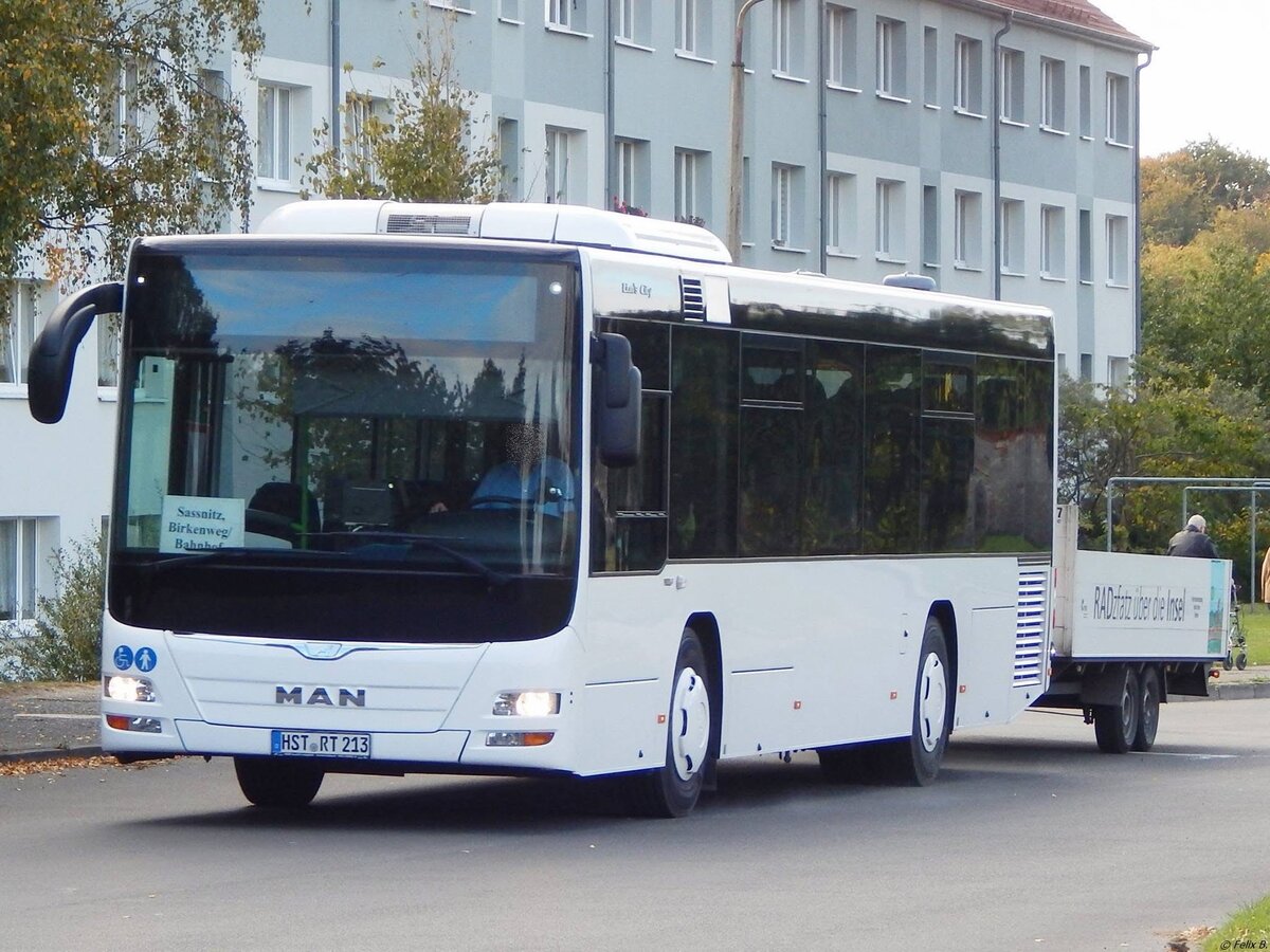 MAN Lion's City LE Ü vom Reiseienst Teske aus Deutschland mit Anhänger in Sassnitz.