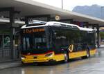 (267'855) - D�nser, Trimmis - GR 95'517/PID 11'896 - eScania (ex GR 184'921) am 8. Oktober 2024 beim Bahnhof Chur
