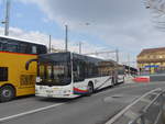 (224'037) - PostAuto Nordschweiz - NE 165'371 - MAN (ex AG 271'181) am 7. Mrz 2021 beim Bahnhof Neuchtel