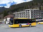 (260'540) - GrindelwaldBus, Grindelwald - Nr. 13/BE 407'170 - MAN/Gppel am 19. Mrz 2024 beim Bahnhof Grindelwald