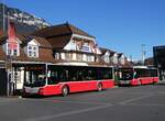 (269'912) - PostAuto Bern - BE 654'090/PID 12'33? - MAN (ex A-Wien) + BE 403'166/PID 12'33? - MAN (ex A-Wien) am 16. Dezember 2024 beim Bahnhof Interlaken Ost