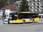 (272'182) - GrindelwaldBus, Grindelwald - Nr. 20/BE 349'361 - MAN/Gppel am 17. Februar 2025 beim Bahnhof Grindelwald