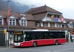 (273'245) - PostAuto Bern - BE 403'166/PID 12'336 - MAN (ex Dr. Richard, A-Wien Nr. 1411) am 28. März 2025 beim Bahnhof Interlaken Ost 