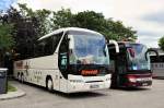 NEOPLAN TOURLINER von STEIDL / BRD am 14.6.2013 in Krems,rechts ein Setra 416 GT-HD aus der BRD.