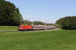 1116 141 war am 12. Mai 2024 mit einem  EC  bei Axdorf in Richtung Mnchen unterwegs.