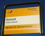 (137'001) - PostAuto-Haltestellenschild - Gstaad, Unter Gstaad - am 25. November 2011