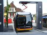 (290'892) - PostAuto Wallis - VS 581'433/PID 12'161 - eMercedes am 17. September 2026 beim Bahnhof Spiez